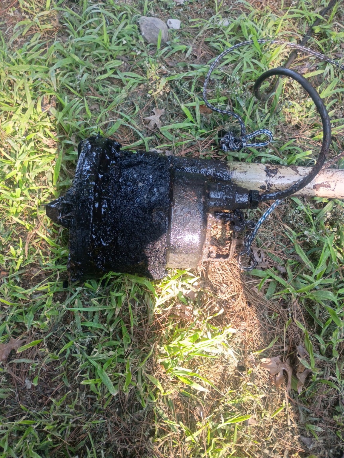 Failed submersible pump removed from the chamber for identification and condition documentation