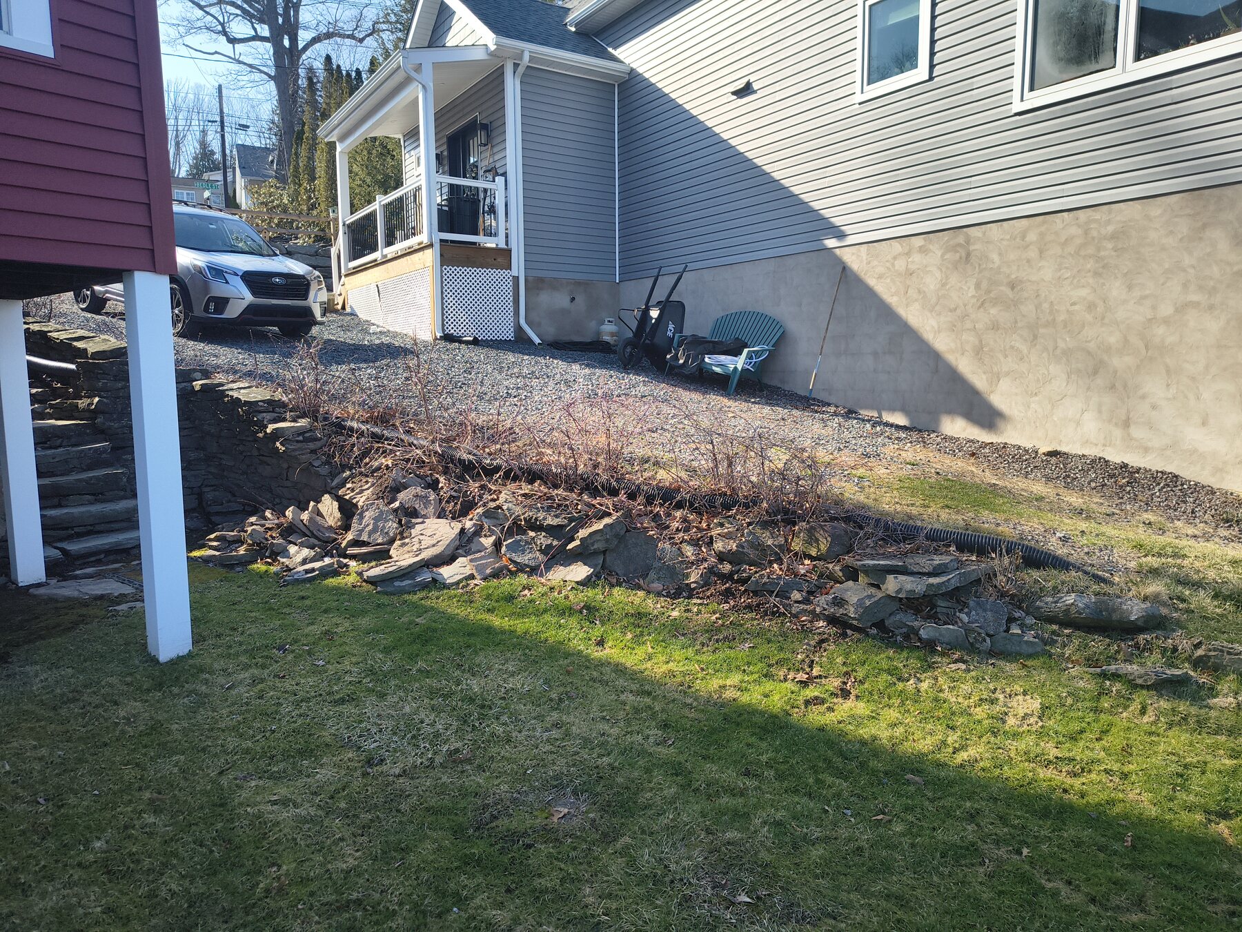 Exterior drainage and access restoration: Before — disturbed side-yard access